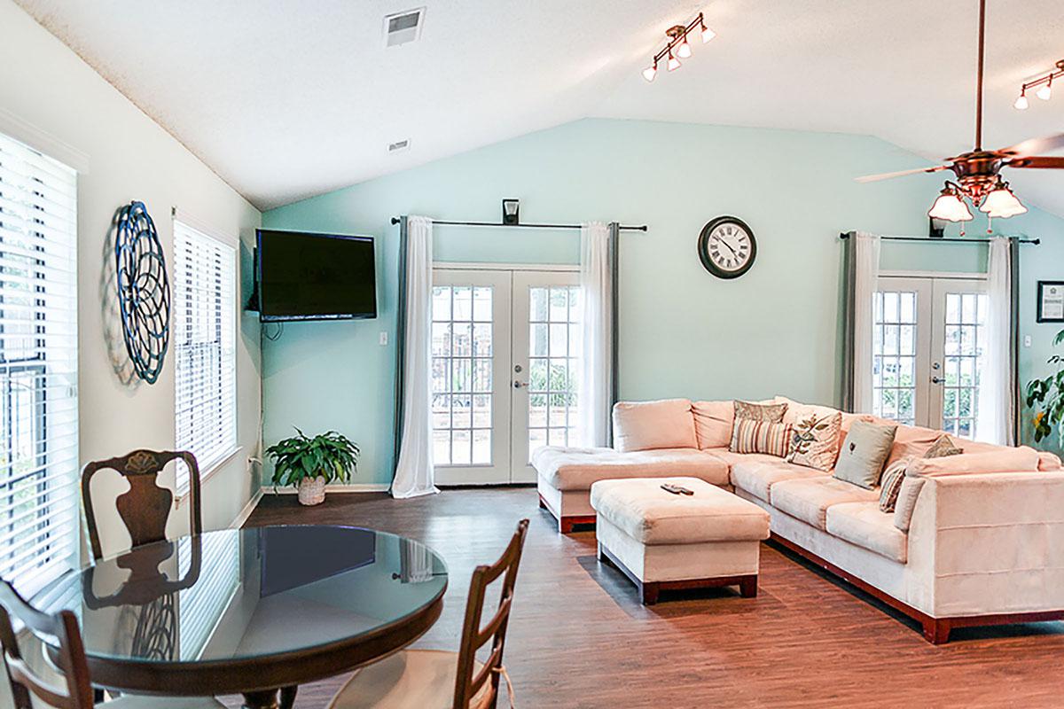Living room with comfortable sofa and dining table.