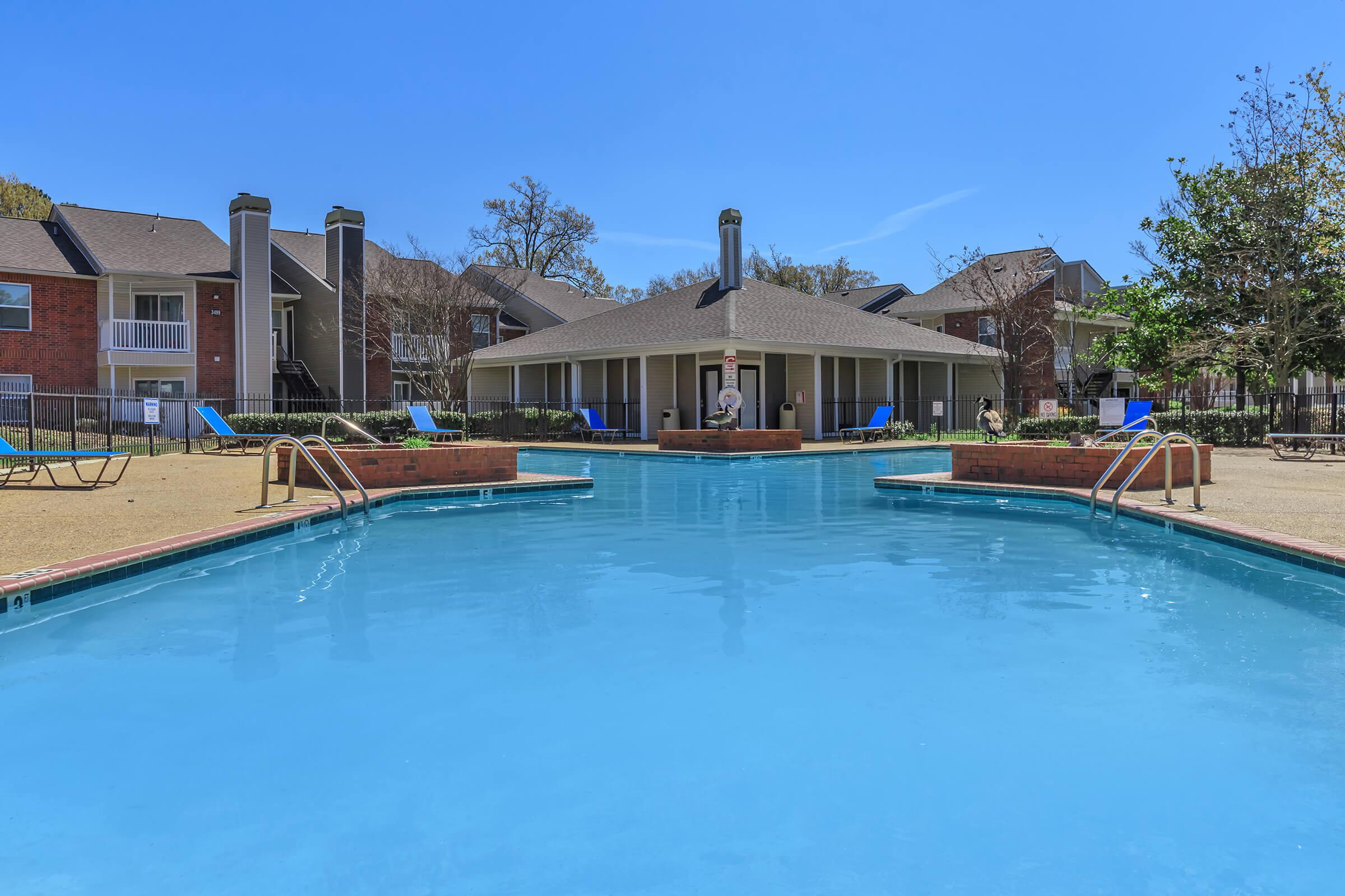 Poolside with building view.