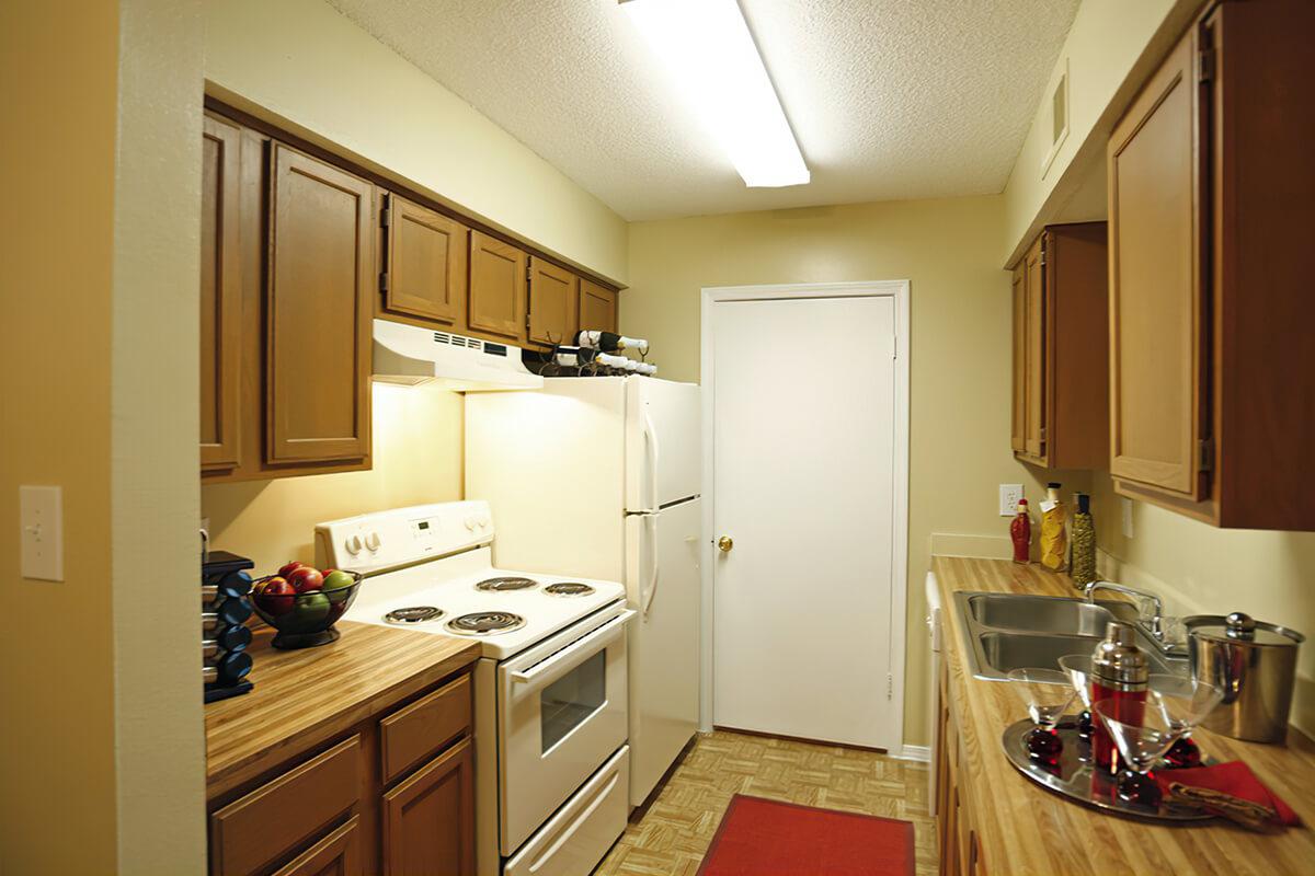 Kitchen with wood cabinets and countertops.