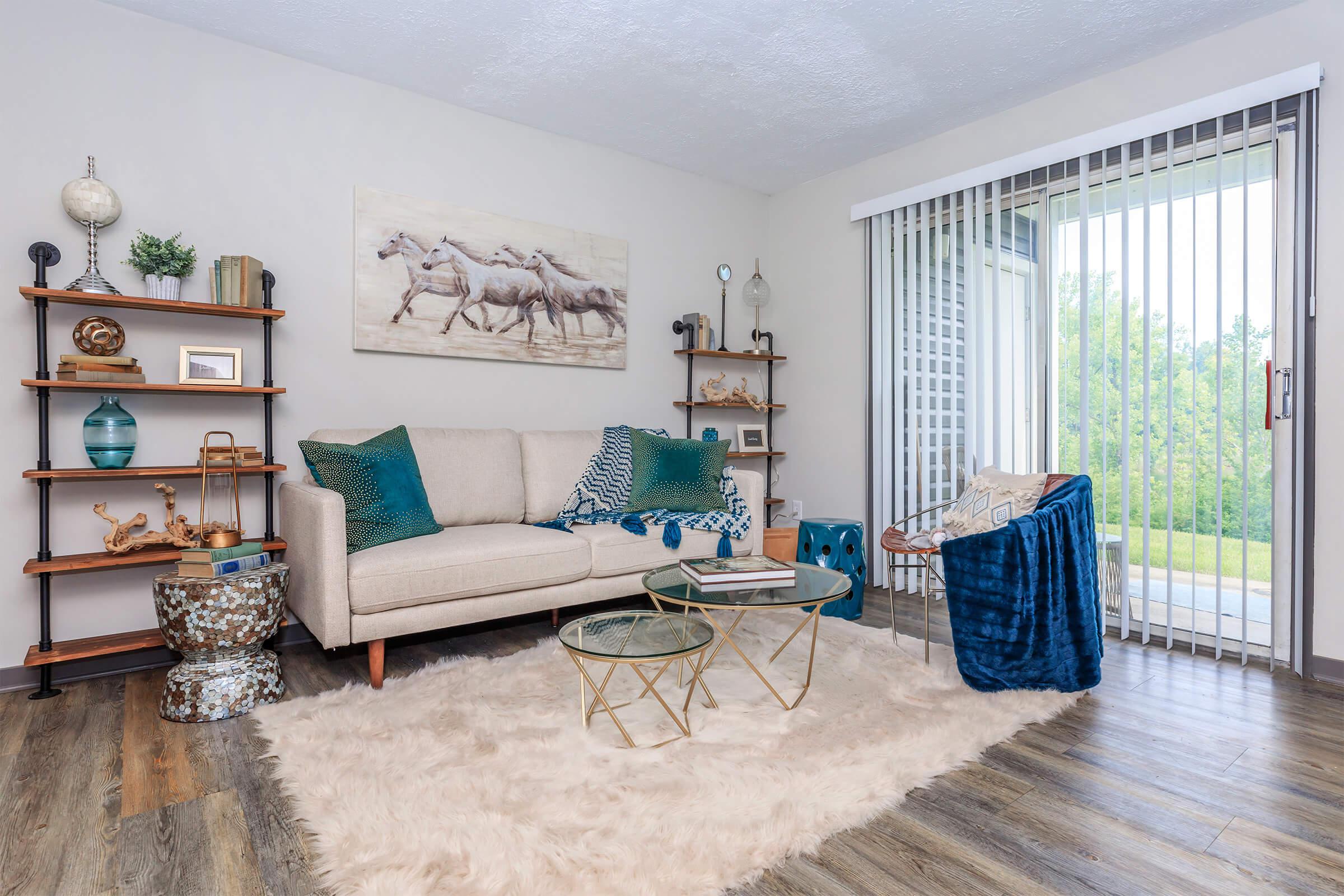 Bright bedroom with a neatly made bed and modern decor.