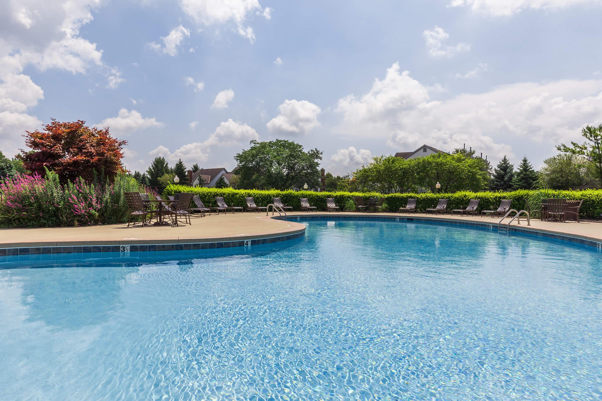 community pool with green landscaping
