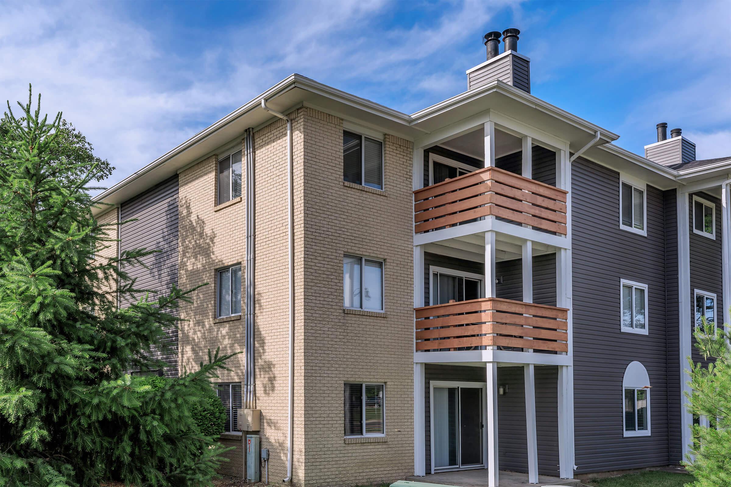 Exterior of a multi-story apartment building with balconies