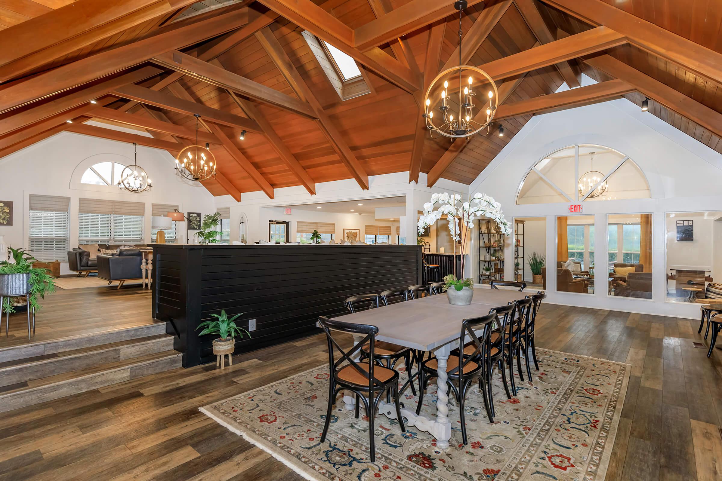 interior dining area with dropped wood ceiling