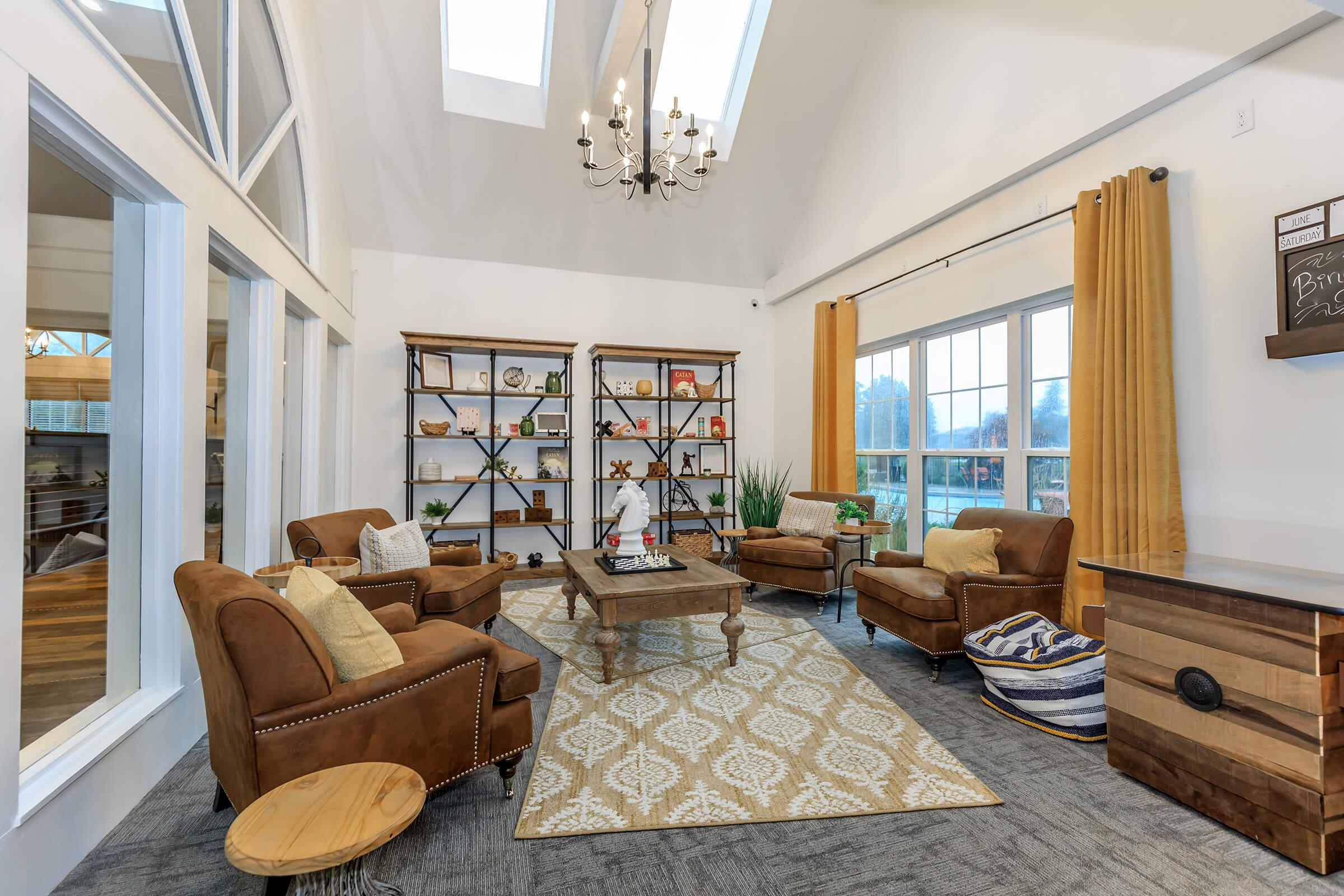 sitting room with furniture and large window